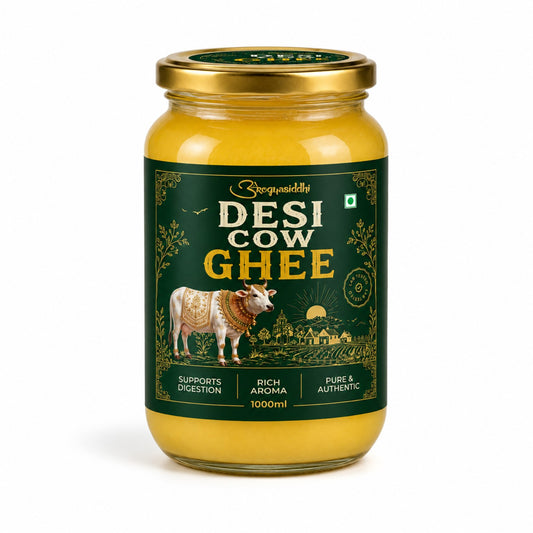 A 1000ml glass jar of Surajkundli Desi Cow Ghee, filled with golden yellow ghee and featuring a dark green label with a cow illustration and a gold lid, set against a plain white background.